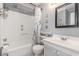 Clean bathroom with tub shower and coastal decor at 6000 N Ocean Blvd. # 205, North Myrtle Beach, SC 29582