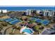 Aerial view of community with tennis courts, pool, and oceanfront location at 601 Retreat Beach Circle # 124, Pawleys Island, SC 29585