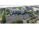 Aerial view of beachfront resort complex with pool and parking at 601 Retreat Beach Circle # 124, Pawleys Island, SC 29585
