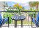Balcony with table and chairs overlooking ocean and landscape at 601 Retreat Beach Circle # 124, Pawleys Island, SC 29585