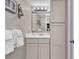 Clean bathroom with vanity, large mirror, and linen closet at 601 Retreat Beach Circle # 124, Pawleys Island, SC 29585