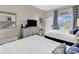 Bedroom with two twin beds, dresser, TV, and balcony view at 601 Retreat Beach Circle # 124, Pawleys Island, SC 29585