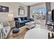 Living room with ocean view, featuring coastal decor and hardwood floors at 601 Retreat Beach Circle # 124, Pawleys Island, SC 29585