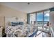 Ocean-view bedroom with king-size bed and access to balcony at 601 Retreat Beach Circle # 328, Litchfield, SC 29585