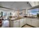 Open kitchen with granite countertops and white cabinets at 601 Retreat Beach Circle # 328, Litchfield, SC 29585