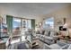 Living room with ocean view, comfy seating, and coastal decor at 601 Retreat Beach Circle # 328, Litchfield, SC 29585