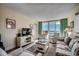 Spacious living room boasts ocean views and comfortable furnishings at 601 Retreat Beach Circle # 328, Litchfield, SC 29585