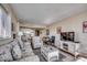 Living room with ocean view, comfy seating, and coastal decor at 601 Retreat Beach Circle # 328, Litchfield, SC 29585
