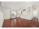 Living room with hardwood floors, built-ins, and access to hallway at 605 Cedar Ln., North Myrtle Beach, SC 29582