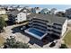 Aerial view showing Pelican Pass building, pool, and parking lot at 612 S Ocean Blvd. # 104A, Surfside Beach, SC 29575
