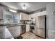 Modern kitchen with granite counters and stainless steel appliances at 612 S Ocean Blvd. # 104A, Surfside Beach, SC 29575