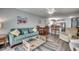 Bright living room with comfortable seating and access to balcony at 612 S Ocean Blvd. # 104A, Surfside Beach, SC 29575