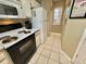 White appliances and cabinets in this galley kitchen at 636 Waterway Village Blvd. # 17C, Myrtle Beach, SC 29579