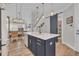 Modern kitchen with white cabinets and a navy island at 782 Aqua Dr, Myrtle Beach, SC 29572