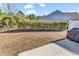 Private backyard with grassy area, hedge, and grilling station at 834 Arezzo Way # 834, Myrtle Beach, SC 29579