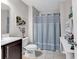 Light and airy bathroom with a shower/tub combo, vanity, and neutral decor at 834 Arezzo Way # 834, Myrtle Beach, SC 29579