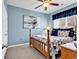 Cozy bedroom featuring a wooden bed frame, a ceiling fan, and a large window at 834 Arezzo Way # 834, Myrtle Beach, SC 29579
