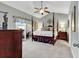 Spacious Primary bedroom with a large four-poster bed and access to a private patio at 834 Arezzo Way # 834, Myrtle Beach, SC 29579