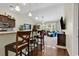 Kitchen island with seating overlooks the living room at 834 Arezzo Way # 834, Myrtle Beach, SC 29579