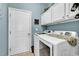 Laundry room offers ample storage and modern appliances at 834 Arezzo Way # 834, Myrtle Beach, SC 29579