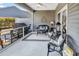 Spacious screened porch with wicker furniture and a gas grill at 834 Arezzo Way # 834, Myrtle Beach, SC 29579
