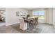 Bright dining room with a wooden table and six chairs at 839 Buttonwood Dr., Conway, SC 29527