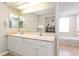 Bathroom boasts dual sinks and ample cabinet space with a separate shower and tub area at 8560 Queensway Blvd. # 1210, Myrtle Beach, SC 29572