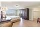 Comfortable bedroom with wood floors, view of ocean, and dark wood cabinet at 8560 Queensway Blvd. # 1210, Myrtle Beach, SC 29572