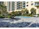 Enjoy the outdoors with a beautiful blue pool steps away from this high-rise condo building at 8560 Queensway Blvd. # 1210, Myrtle Beach, SC 29572