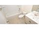 Clean bathroom with a tub, toilet and vanity at 920 Belle Dr., North Myrtle Beach, SC 29582