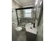 Bathroom with tub, sink, and modern fixtures at 923 N Waccamaw Dr., Garden City Beach, SC 29576
