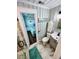 Clean bathroom with toilet, sink, and shower at 923 N Waccamaw Dr., Garden City Beach, SC 29576