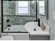 Bathroom with tub, sink, and modern fixtures at 923 N Waccamaw Dr., Garden City Beach, SC 29576