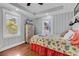 Peaceful bedroom with coastal decor and hardwood floors at 923 N Waccamaw Dr., Garden City Beach, SC 29576
