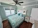 Beachy bedroom with hardwood floors and a ceiling fan at 923 N Waccamaw Dr., Garden City Beach, SC 29576