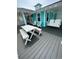 Spacious deck with seating and a porch swing at 923 N Waccamaw Dr., Garden City Beach, SC 29576