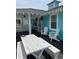 Charming deck with rocking chairs and a table at 923 N Waccamaw Dr., Garden City Beach, SC 29576