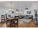 Dining room features a rustic wooden table and hardwood floors at 923 N Waccamaw Dr., Garden City Beach, SC 29576