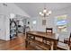 Rustic farmhouse dining table in bright dining area at 923 N Waccamaw Dr., Garden City Beach, SC 29576
