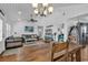 Bright dining room with rustic wooden table and white walls at 923 N Waccamaw Dr., Garden City Beach, SC 29576