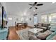 Living room features hardwood floors, coastal decor, and comfy sofa at 923 N Waccamaw Dr., Garden City Beach, SC 29576
