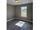 Well-lit bedroom with large window and vinyl plank flooring at Tbb14 Casey Dr., Green Sea, SC 29545