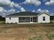 House exterior with screened porch and large backyard at Tbb14 Casey Dr., Green Sea, SC 29545