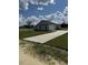 Newly built home showcasing a large yard and concrete driveway at Tbb14 Casey Dr., Green Sea, SC 29545