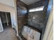 Modern shower with dark tile and built-in shelving at Tbd 12 Casey Dr., Green Sea, SC 29545
