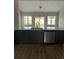 Modern kitchen with dark cabinets, island, and stainless steel appliances at Tbd 13 Casey Dr., Green Sea, SC 29545