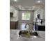 Open concept kitchen with marble countertops and a gold faucet at Tbd 13 Casey Dr., Green Sea, SC 29545