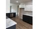 Modern kitchen with dark and white cabinets and marble countertops at Tbd 13 Casey Dr., Green Sea, SC 29545