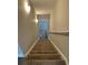 Stairs leading to lower level with carpet runner and lighting at Tbd 13 Casey Dr., Green Sea, SC 29545