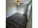 Simple bedroom with dark vinyl flooring and double door closet at Tbd10 Casey Dr., Green Sea, SC 29545